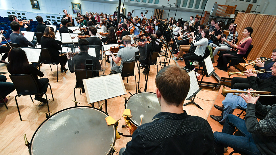 Members of the Chamber Orchestra of Europe in an orchestral rehearsal with RCM students